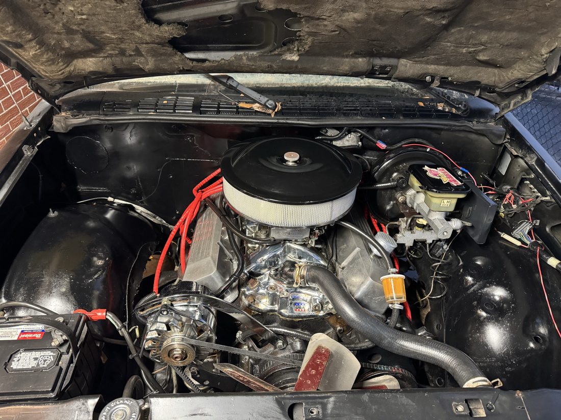 Close-up of a clean chrome-detailed engine under the hood