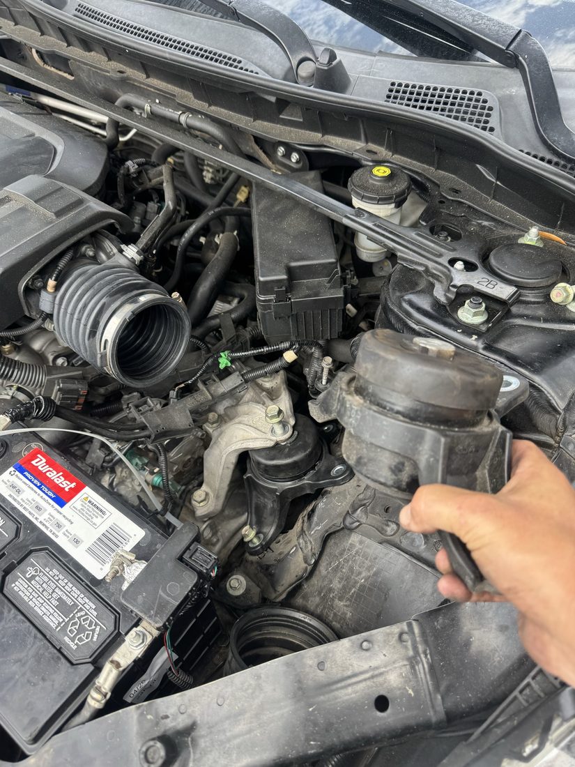 Comparison of an old engine mount next to a newly installed one