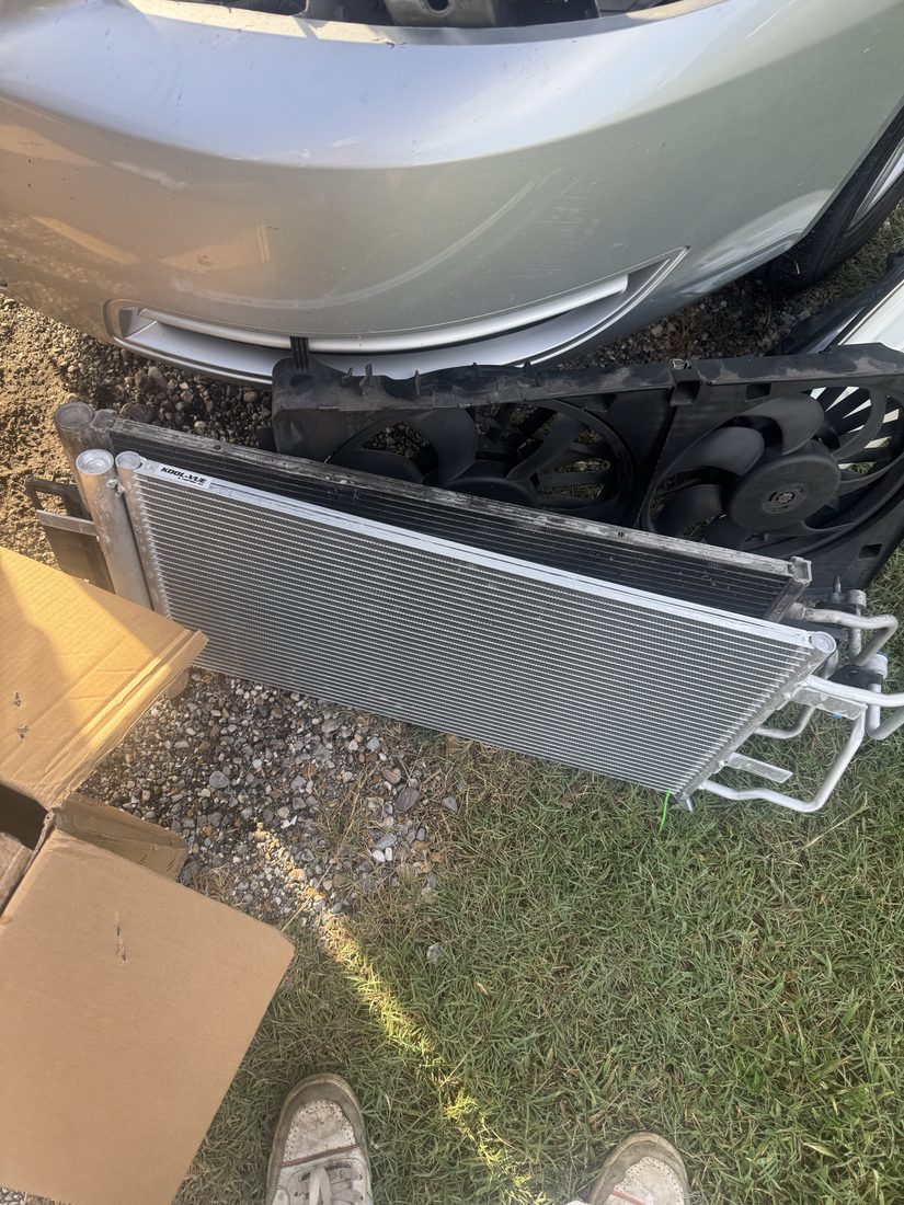 A/C manifold gauges hooked up to a van during air conditioning service